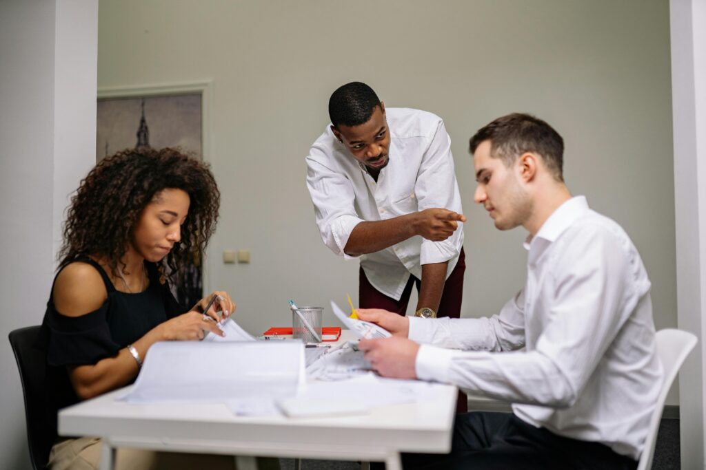 Manager instructing employees.